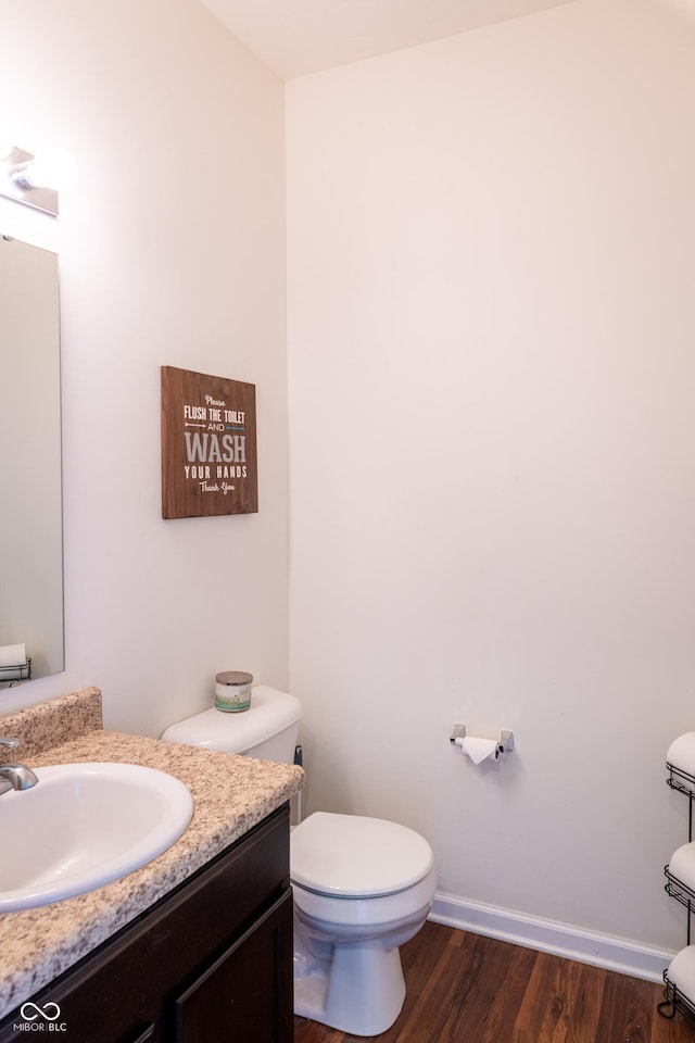 7626 Merrick Dr, Brownsburg, IN 46112 - half bathroom featuring vanity and wood finished floors