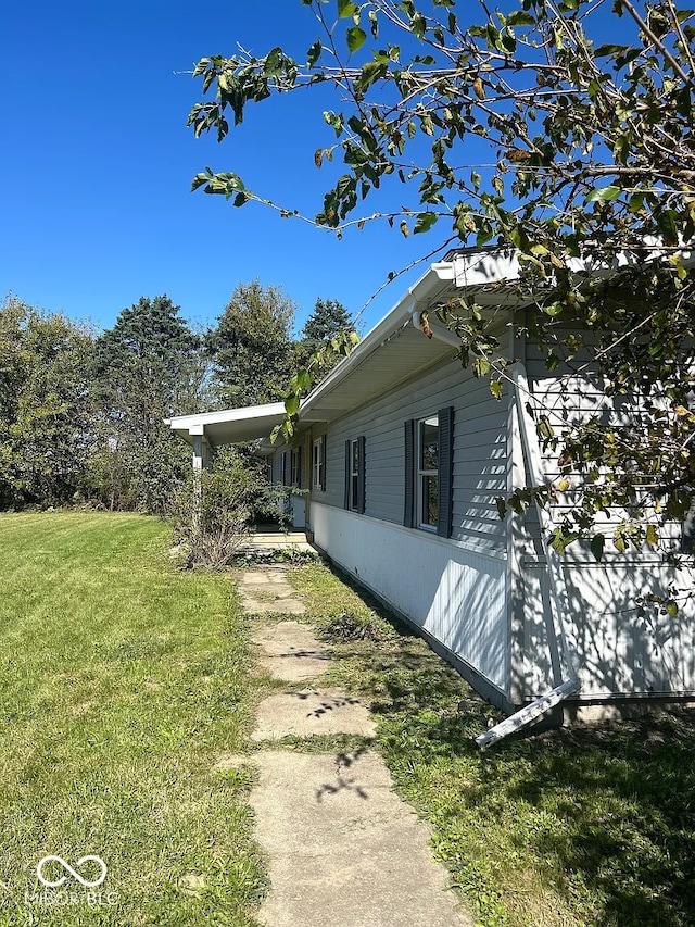 7589 S 100 W, Wabash, IN 46992 - view of side of property featuring a yard