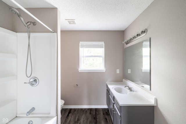 3307 Blue Ash, Indianapolis, IN 46239 - bathroom with vanity, wood finished floors, shower / bath combination, and a textured ceiling