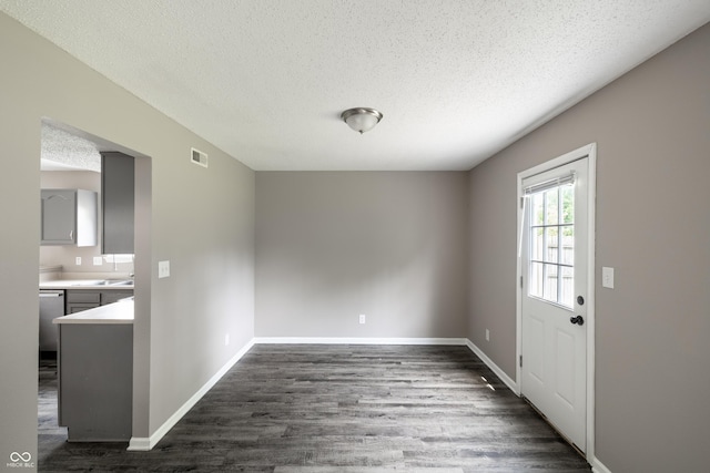 3307 Blue Ash, Indianapolis, IN 46239 - unfurnished dining area featuring a textured ceiling and dark wood-type flooring