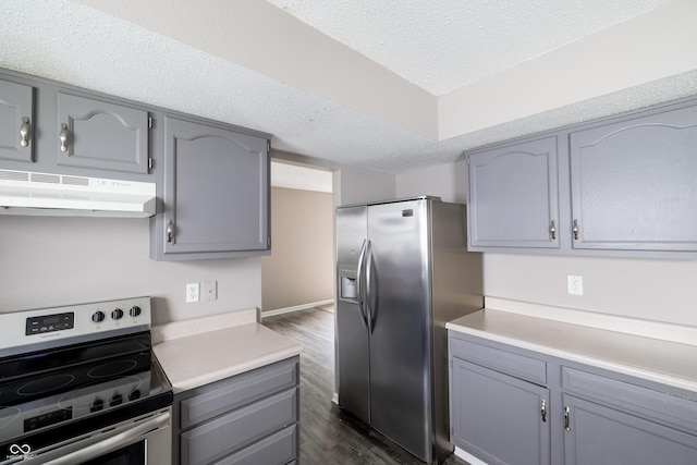 3307 Blue Ash, Indianapolis, IN 46239 - kitchen with stainless steel appliances, under cabinet range hood, gray cabinetry, dark wood-type flooring, and a textured ceiling
