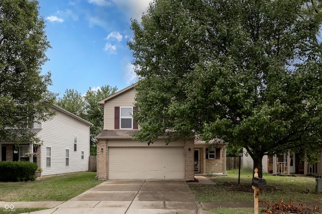 3307 Blue Ash, Indianapolis, IN 46239 - view of front of property with brick siding, driveway, a garage, and a front yard
