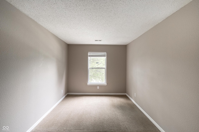 3307 Blue Ash, Indianapolis, IN 46239 - spare room with carpet and a textured ceiling