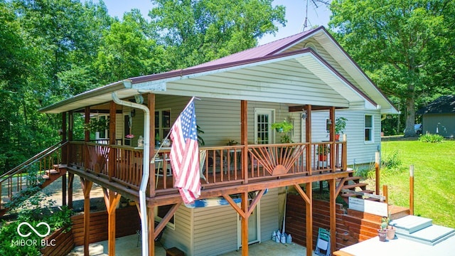 8910 Richarts Rd, Morgantown, IN 46160 - wooden terrace featuring stairs, a lawn, and a patio