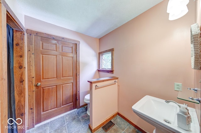 8910 Richarts Rd, Morgantown, IN 46160 - bathroom with toilet and a textured ceiling