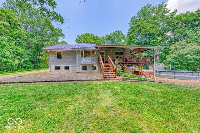 8910 Richarts Rd, Morgantown, IN 46160 - rear view of house featuring stairway, ceiling fan, a yard, and a wooden deck