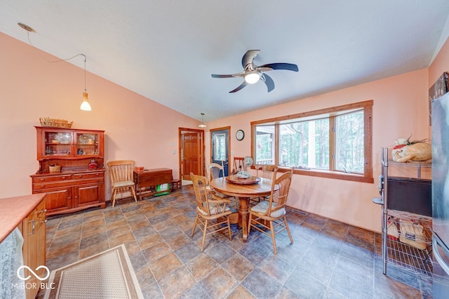8910 Richarts Rd, Morgantown, IN 46160 - dining area with stone finish floors, ceiling fan, and lofted ceiling