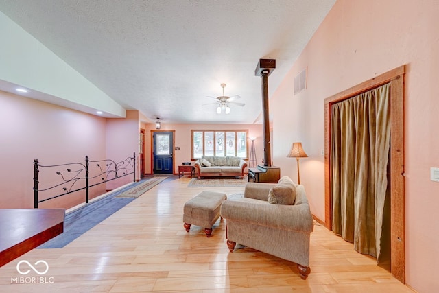 8910 Richarts Rd, Morgantown, IN 46160 - living area with lofted ceiling, light wood-style floors, and ceiling fan