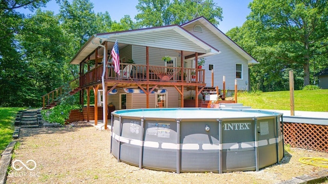 8910 Richarts Rd, Morgantown, IN 46160 - rear view of house with stairs, a wooden deck, and an outdoor pool