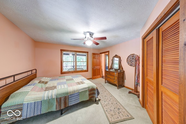8910 Richarts Rd, Morgantown, IN 46160 - bedroom with a textured ceiling, a closet, ceiling fan, and light colored carpet