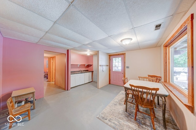 8910 Richarts Rd, Morgantown, IN 46160 - dining space with a paneled ceiling and finished concrete flooring