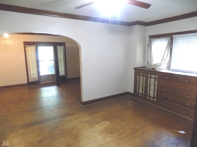 940 N Grant Ave, Indianapolis, IN 46201 - unfurnished room with arched walkways, a ceiling fan, and wood finished floors