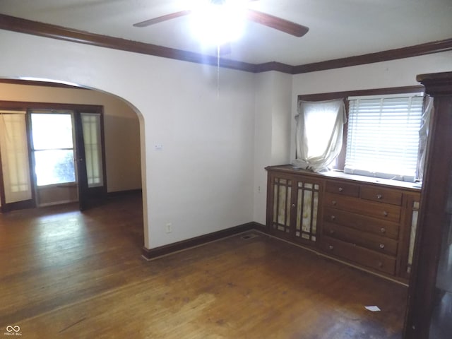 940 N Grant Ave, Indianapolis, IN 46201 - empty room with arched walkways, a ceiling fan, wood finished floors, and crown molding