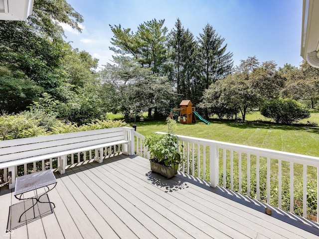 8708 Highwood Ln, Indianapolis, IN 46278 - wooden deck with a playground, a lawn, and view of scattered trees