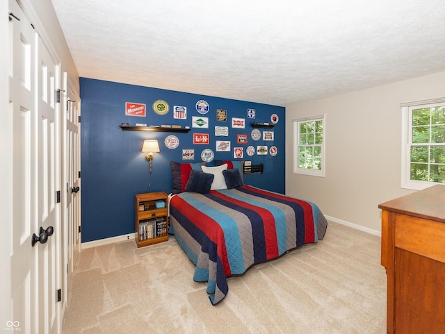 8708 Highwood Ln, Indianapolis, IN 46278 - bedroom featuring carpet flooring, multiple windows, and a textured ceiling