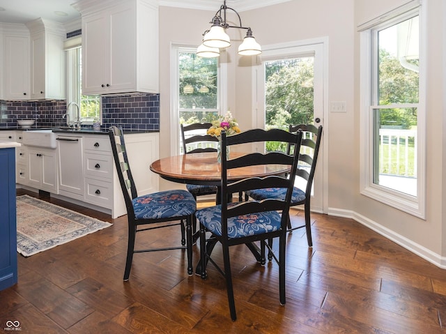 8708 Highwood Ln, Indianapolis, IN 46278 - dining room featuring dark wood-style flooring and ornamental molding