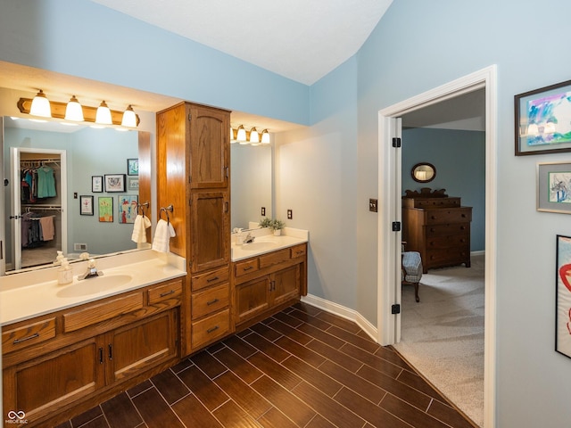 8708 Highwood Ln, Indianapolis, IN 46278 - full bath featuring double vanity, wood finished floors, and a walk in closet