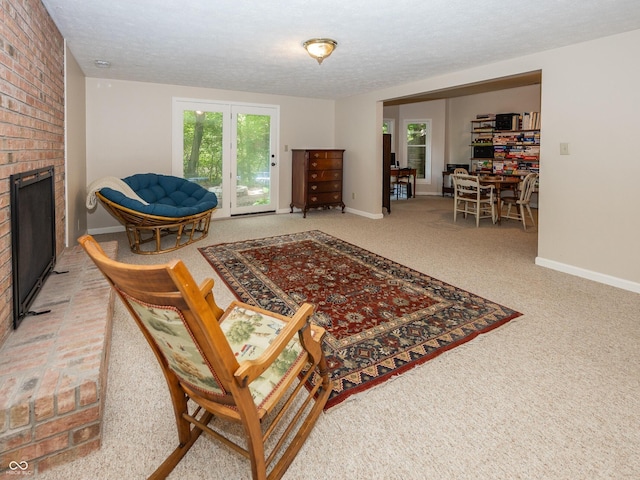 8708 Highwood Ln, Indianapolis, IN 46278 - living area featuring a fireplace, a textured ceiling, and carpet floors
