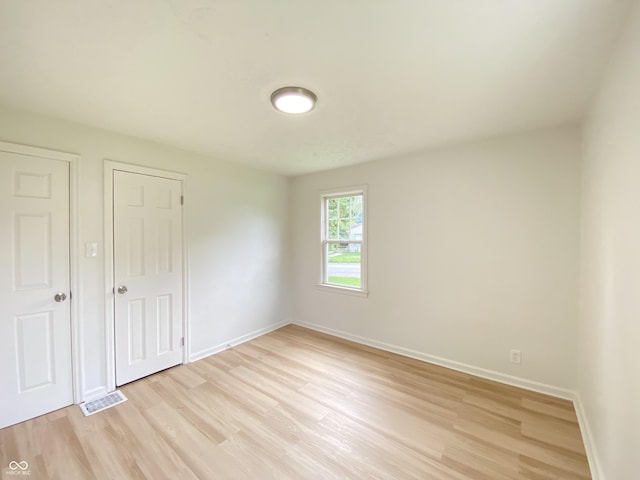 4002 E Pleasant Run Parkway N Drive, Indianapolis, IN 46201 - unfurnished bedroom featuring light wood-style floors and baseboards