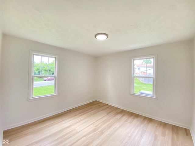 4002 E Pleasant Run Parkway N Drive, Indianapolis, IN 46201 - unfurnished room featuring light wood-style floors and plenty of natural light