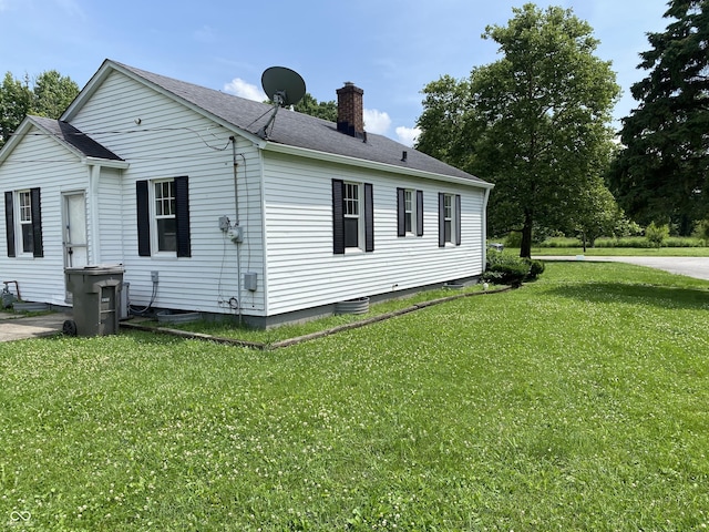 4002 E Pleasant Run Parkway N Drive, Indianapolis, IN 46201 - view of side of home with a chimney, a yard, and a shingled roof