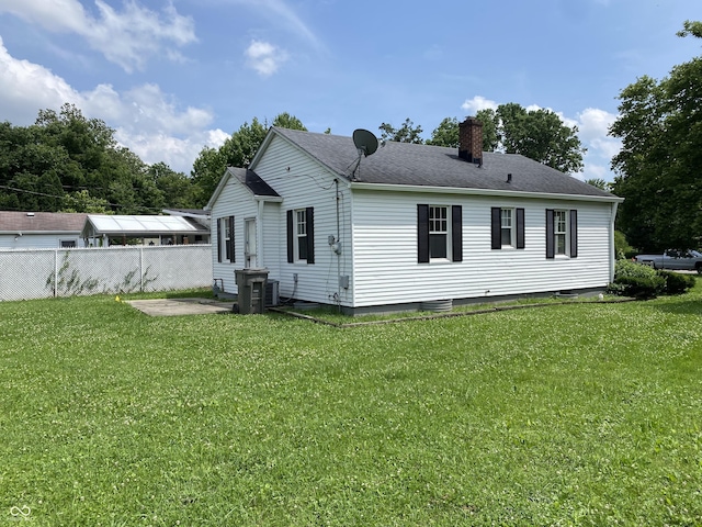 4002 E Pleasant Run Parkway N Drive, Indianapolis, IN 46201 - rear view of house with a chimney, a patio area, and a shingled roof