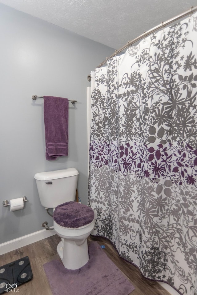 5237 Honey Comb Ln, Indianapolis, IN 46221 - full bathroom featuring wood finished floors, a textured ceiling, and a shower with curtain