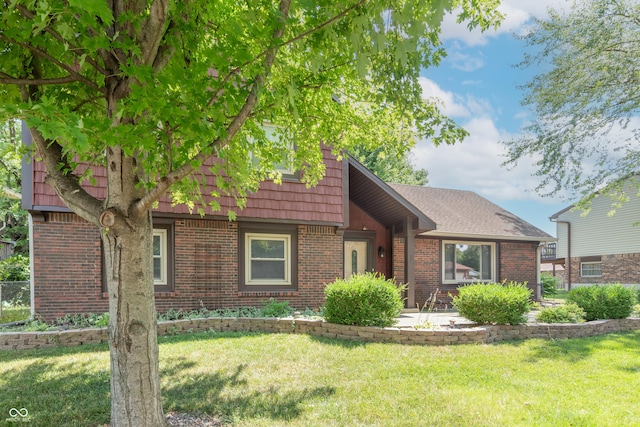5237 Honey Comb Ln, Indianapolis, IN 46221 - view of front facade with brick siding and a front lawn