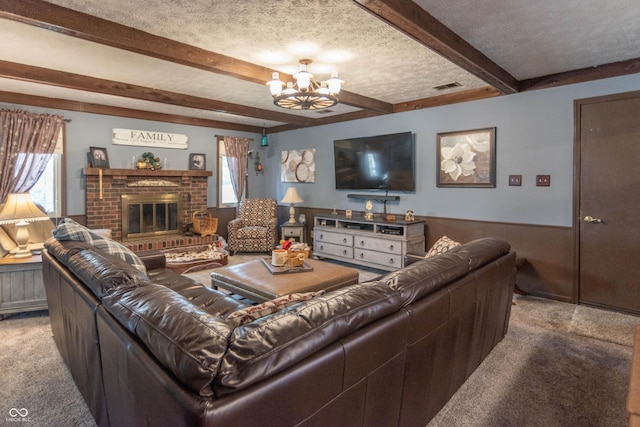 5237 Honey Comb Ln, Indianapolis, IN 46221 - carpeted living room featuring beamed ceiling, a chandelier, a textured ceiling, a fireplace, and wainscoting