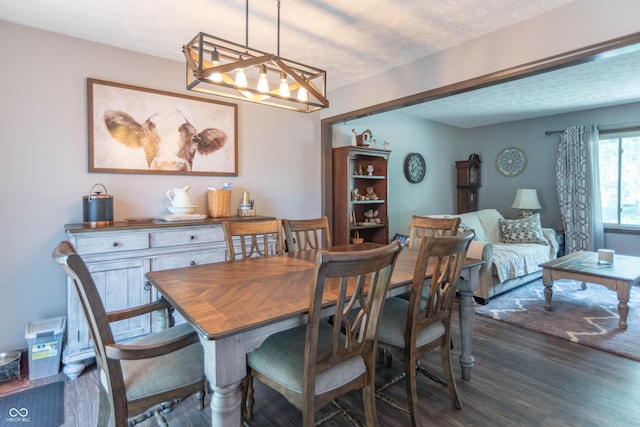 5237 Honey Comb Ln, Indianapolis, IN 46221 - dining space featuring a chandelier, wood finished floors, and a textured ceiling