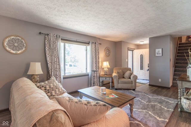 5237 Honey Comb Ln, Indianapolis, IN 46221 - living area featuring stairs, wood finished floors, and a textured ceiling