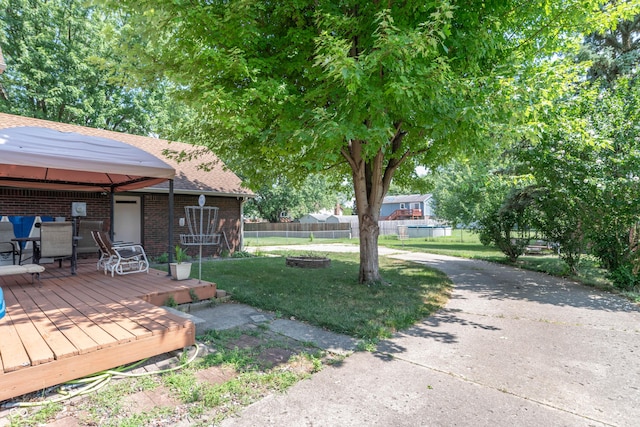 5237 Honey Comb Ln, Indianapolis, IN 46221 - view of yard featuring a wooden deck, an outdoor fire pit, and a gazebo