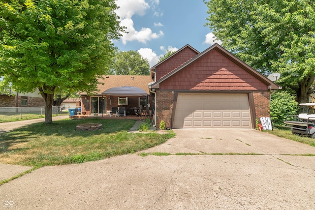 5237 Honey Comb Ln, Indianapolis, IN 46221 - view of front of house with concrete driveway, brick siding, and a garage