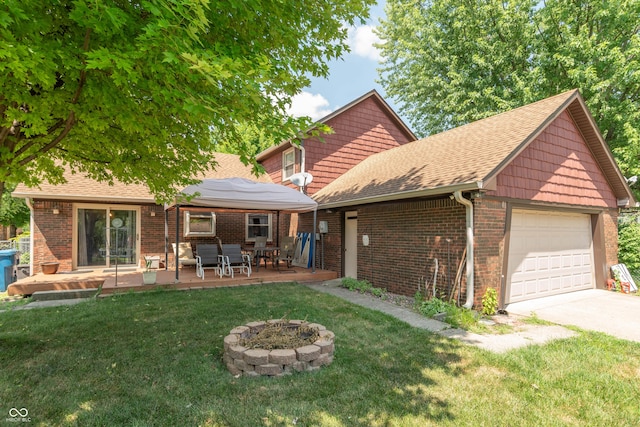 5237 Honey Comb Ln, Indianapolis, IN 46221 - rear view of house with a garage, a lawn, driveway, a shingled roof, and brick siding