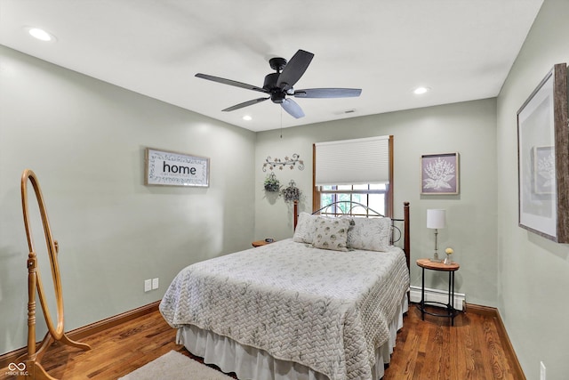 5238 N 225 E, Whiteland, IN 46184 - bedroom featuring baseboard heating, wood finished floors, ceiling fan, and recessed lighting