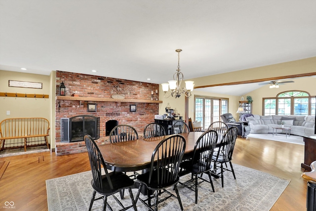 5238 N 225 E, Whiteland, IN 46184 - dining space featuring ceiling fan, wood finished floors, a brick fireplace, a chandelier, and recessed lighting