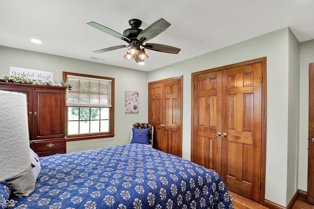 5238 N 225 E, Whiteland, IN 46184 - bedroom with two closets, light wood finished floors, a ceiling fan, and recessed lighting