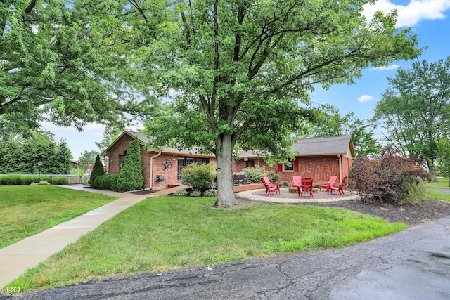 5238 N 225 E, Whiteland, IN 46184 - single story home with brick siding, a front yard, and an outdoor fire pit