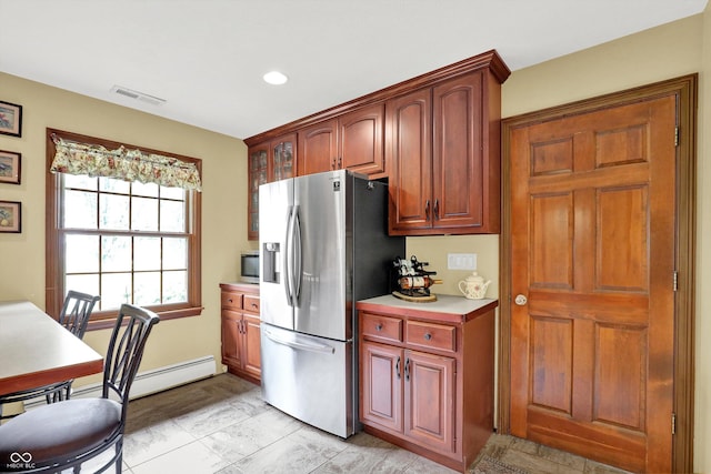 5238 N 225 E, Whiteland, IN 46184 - kitchen with stainless steel fridge, light countertops, baseboard heating, recessed lighting, and glass insert cabinets