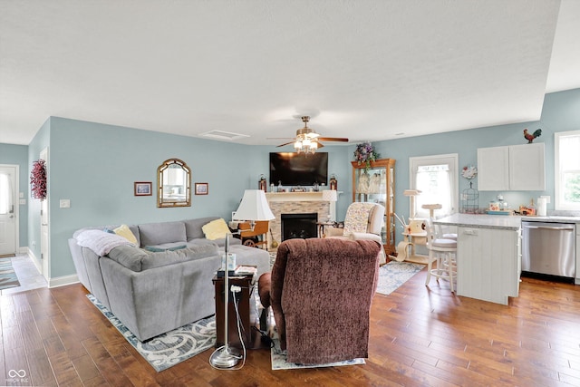 5238 N 225 E, Whiteland, IN 46184 - living area featuring ceiling fan, hardwood / wood-style floors, and a stone fireplace