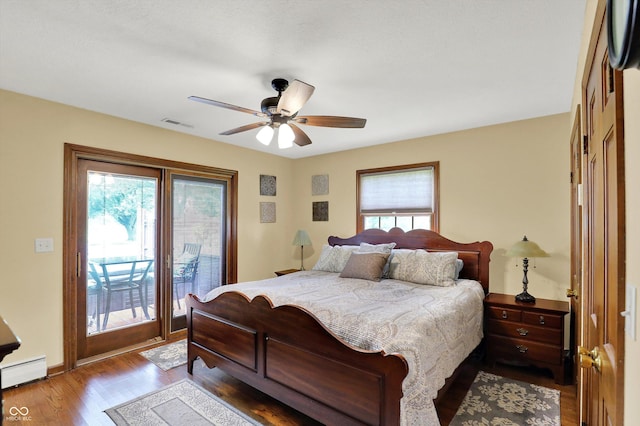 5238 N 225 E, Whiteland, IN 46184 - bedroom with multiple windows, access to outside, wood finished floors, and a baseboard heating unit