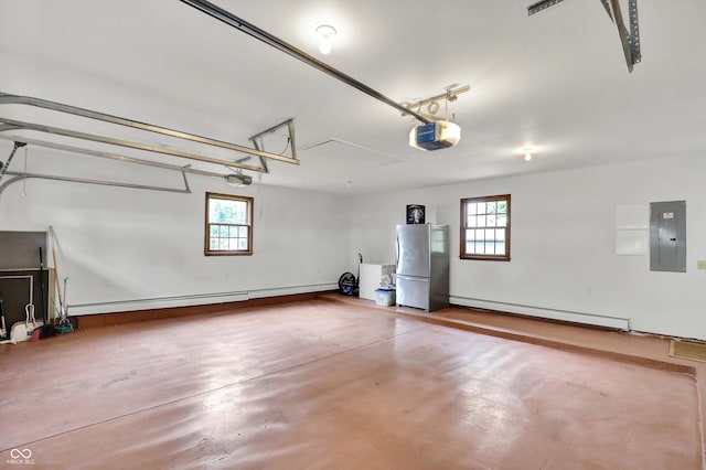 5238 N 225 E, Whiteland, IN 46184 - garage featuring freestanding refrigerator, baseboard heating, a garage door opener, and electric panel