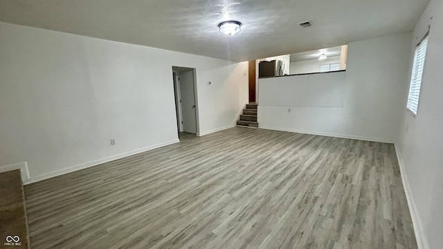 7231 S Franklin Rd, Indianapolis, IN 46259 - unfurnished living room featuring stairway and wood finished floors