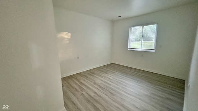 7231 S Franklin Rd, Indianapolis, IN 46259 - empty room with wood finished floors and baseboards