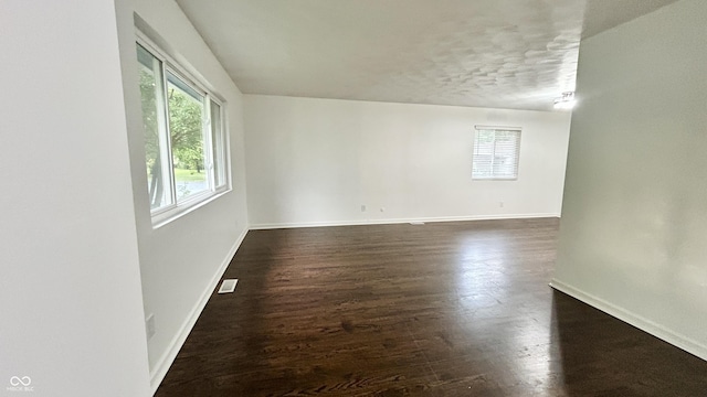 7231 S Franklin Rd, Indianapolis, IN 46259 - unfurnished room with plenty of natural light, dark wood-type flooring, and a textured ceiling