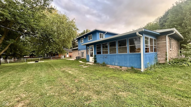 7231 S Franklin Rd, Indianapolis, IN 46259 - back of property featuring a sunroom and stone siding
