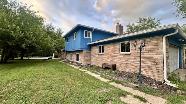 7231 S Franklin Rd, Indianapolis, IN 46259 - view of side of home with stone siding, a chimney, and a yard