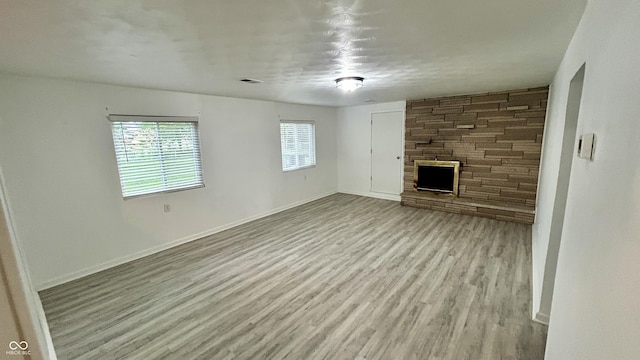 7231 S Franklin Rd, Indianapolis, IN 46259 - unfurnished living room with a fireplace and wood finished floors