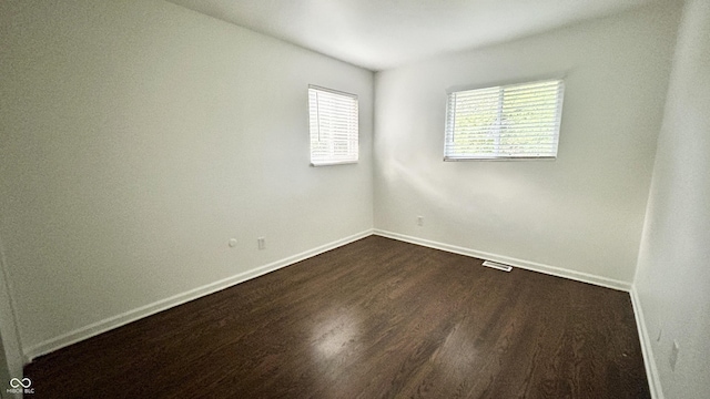 7231 S Franklin Rd, Indianapolis, IN 46259 - empty room featuring healthy amount of natural light and dark wood finished floors
