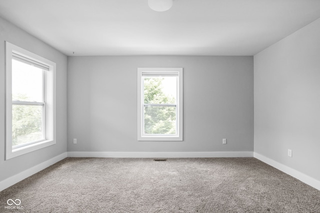 1935 Cornell Ave, Indianapolis, IN 46202 - unfurnished room featuring healthy amount of natural light and carpet